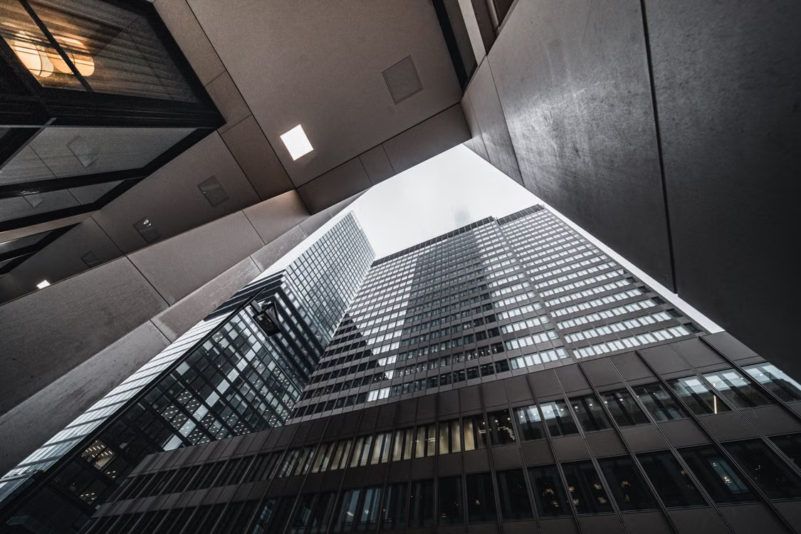 Architectural photography looking upward between city buildings